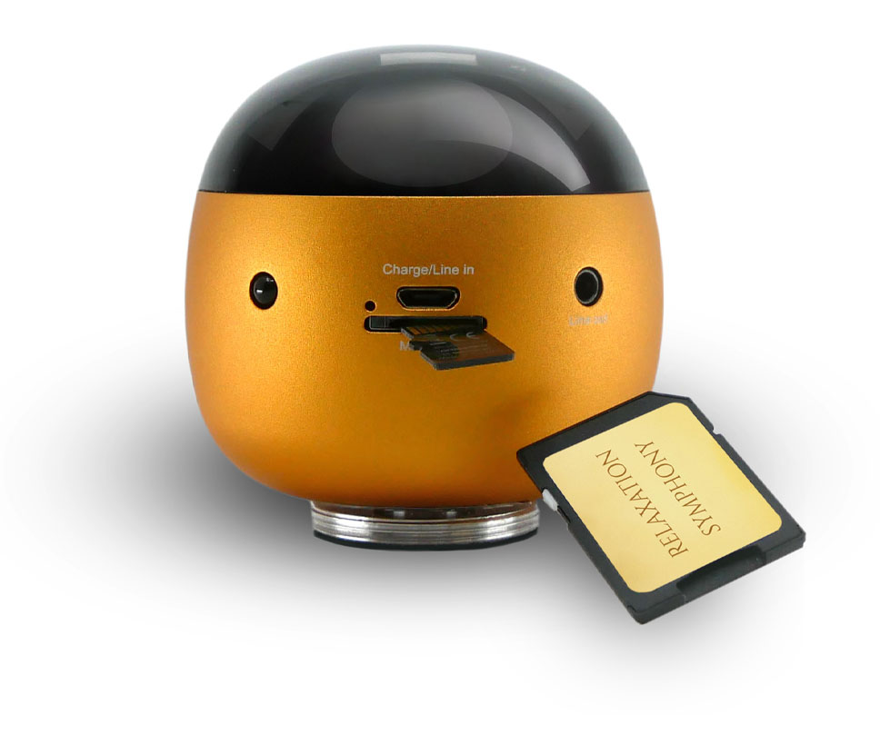 Orange dome-shaped USB speaker with microSD card slot and USB-C/line-in ports.